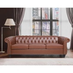 84 in. W Rolled Arm Faux Leather Straight Chesterfield Three Seater Sofa in Brown by GODEER